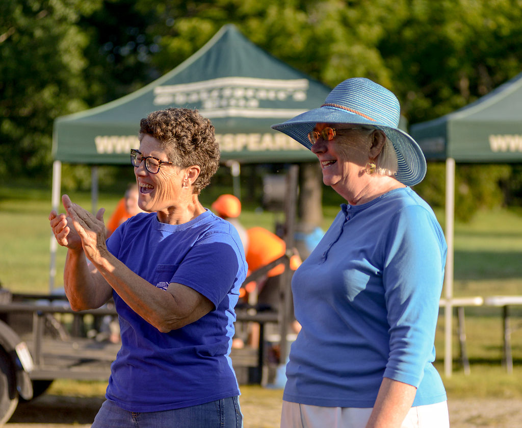 Janet Thompson, left, and Betsy Peters cheer